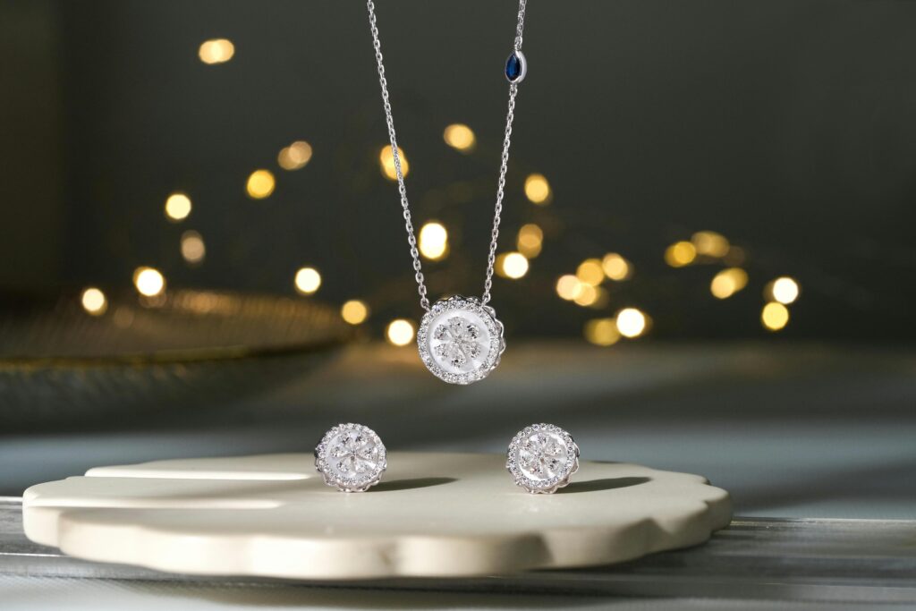Sophisticated diamond earrings and pendant with a festive backdrop in Surat, India.